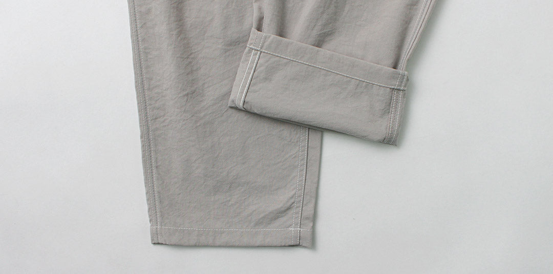 AND WANDER / Pantalon d'escalade en nylon Gramicci