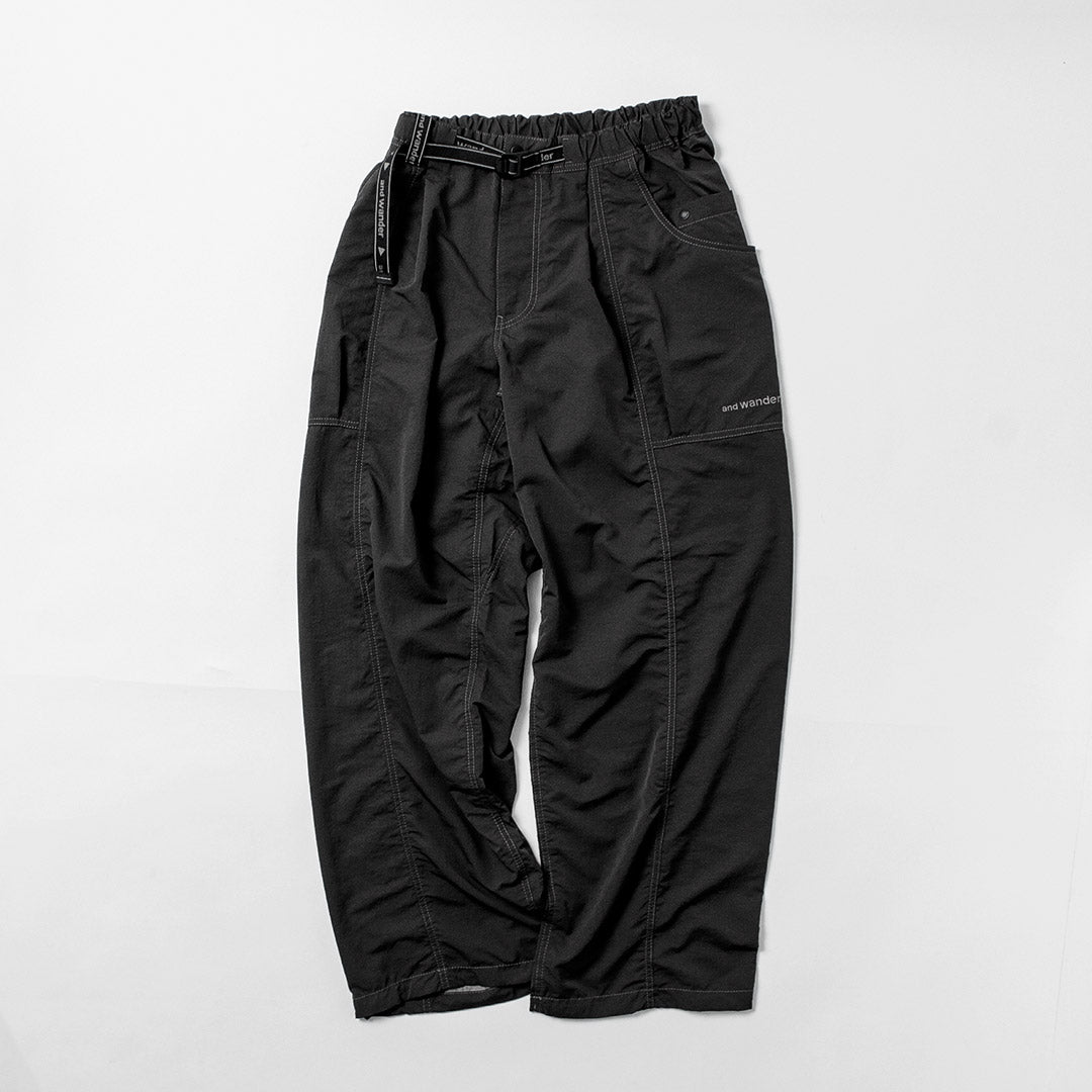 AND WANDER / Crinkle Nylon Pants