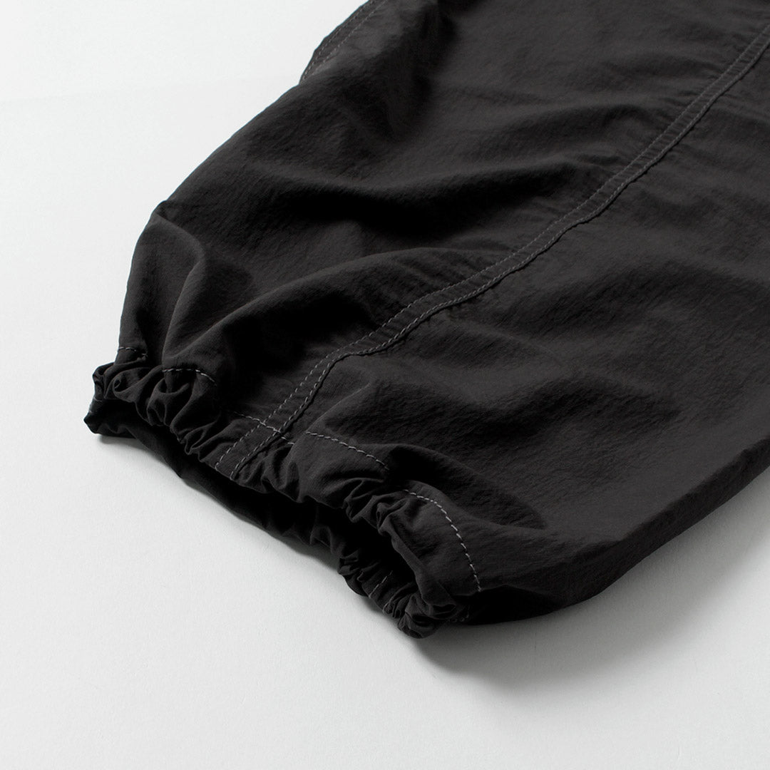 AND WANDER / Crinkle Nylon Pants