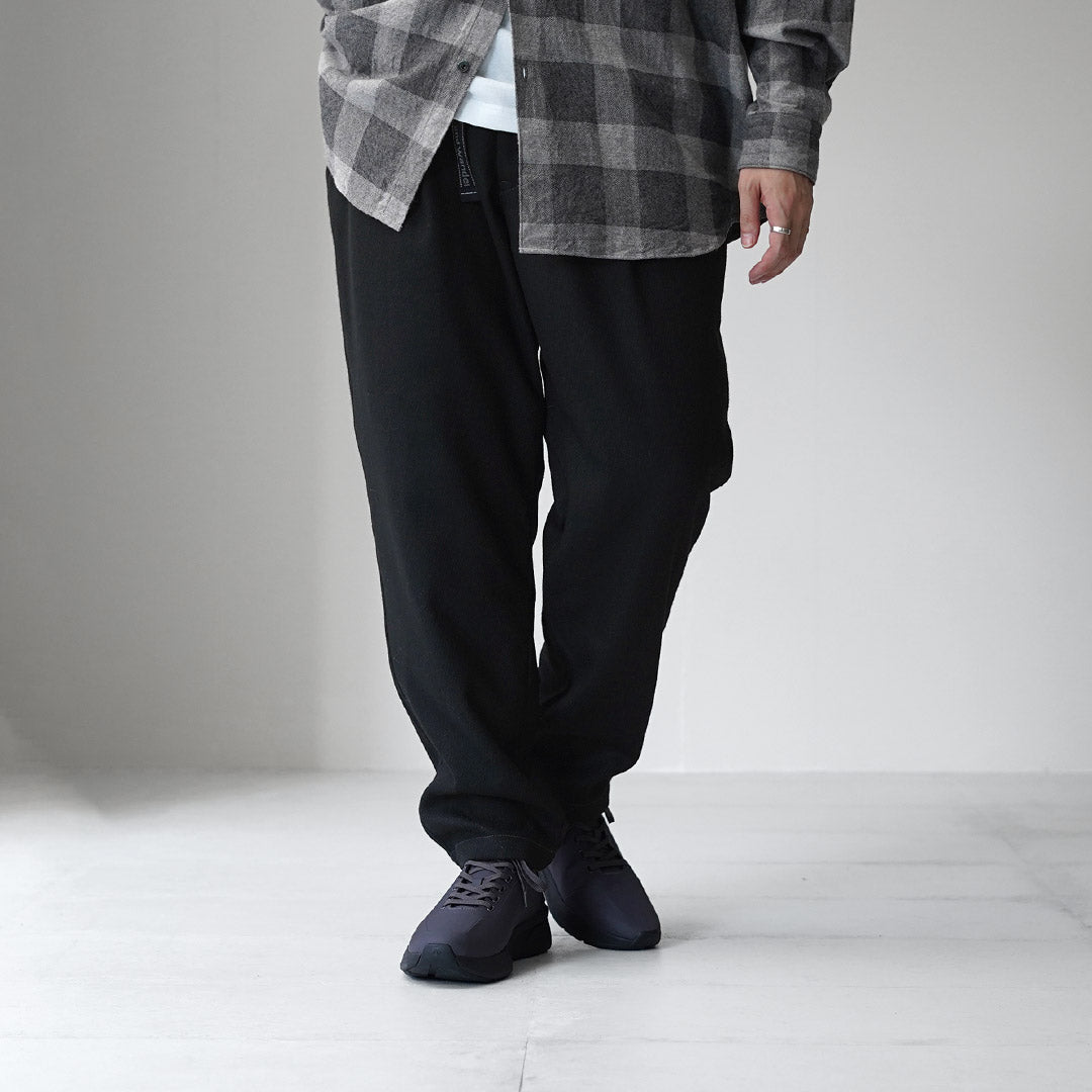 AND WANDER / REWOOL Pantalon fuselé en tweed